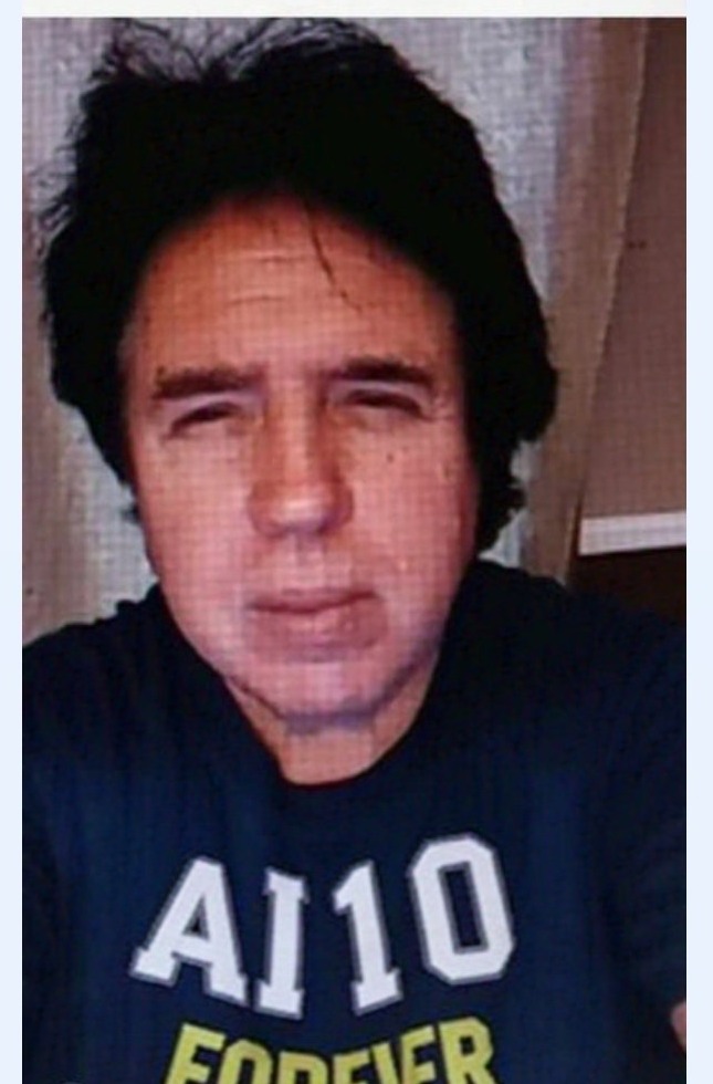 Franklin Langston wearing his navy AI 10 FOREVER t-shirt